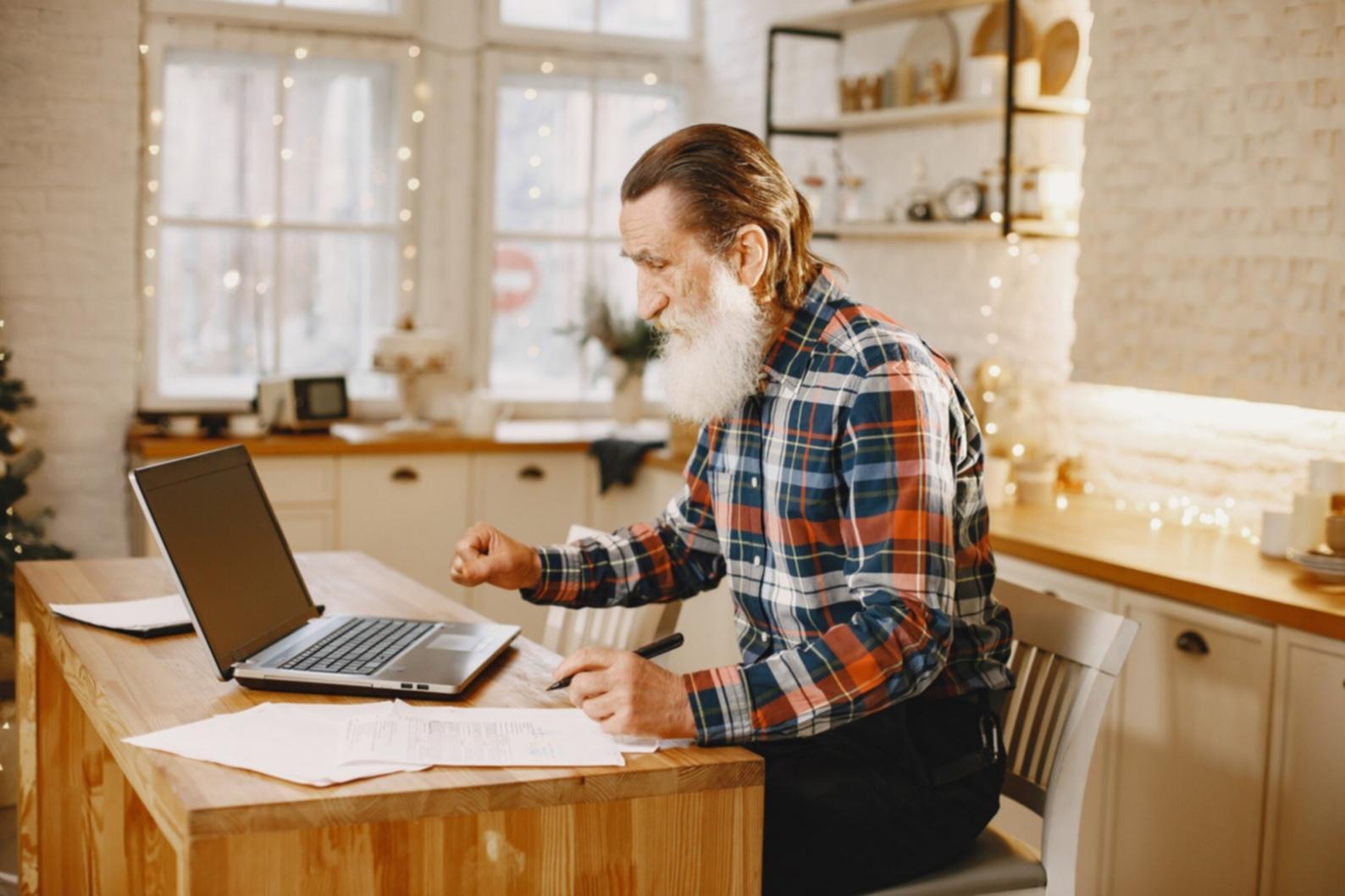 Professional reviewing financial documents with calculator and charts